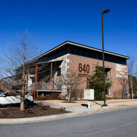 Photo of building and parking lot. 