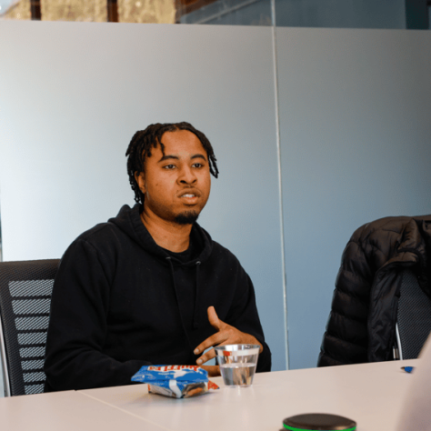 Man talking at a table. 