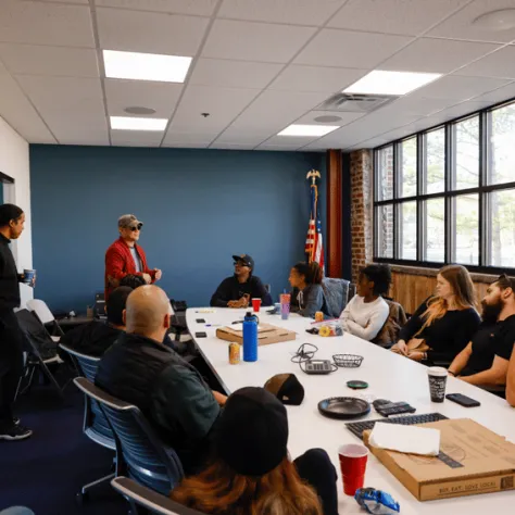 People sitting at conference table. 