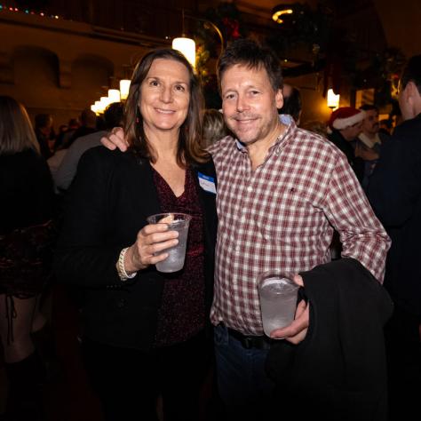 People posing for photo at party.