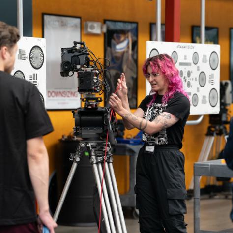 Woman working with a camera. 