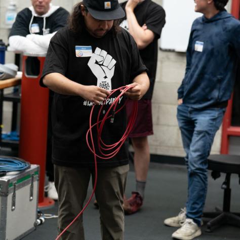 Man working with cable.