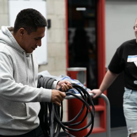 Man working with cable.