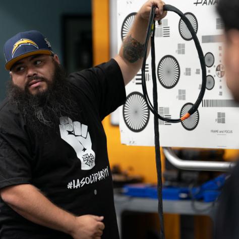 Man working with cable.