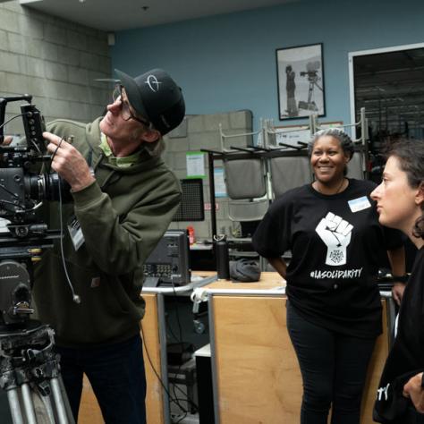 Man working behind a camera. 