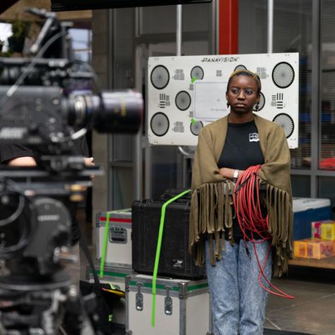 People standing in front of a camera. 