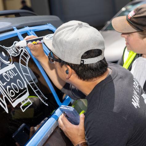 Writing on car window. 