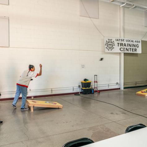 People playing cornhole. 