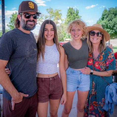 People posing for photo together. 