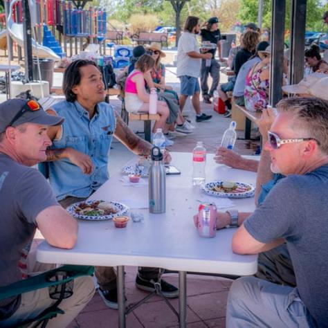 People talking at a table together. 