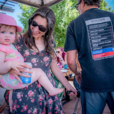 Woman holding a baby. 