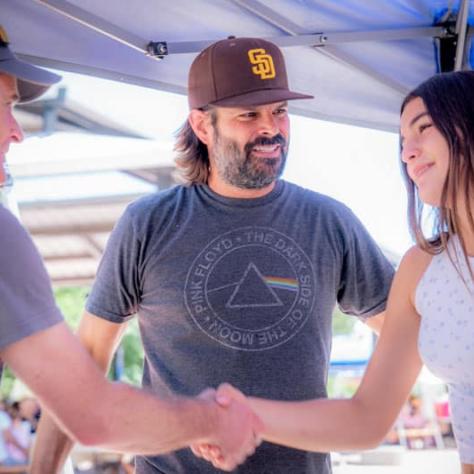 Two people shaking hands. 