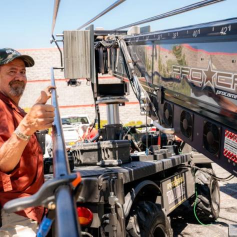 Man working behind camera. 