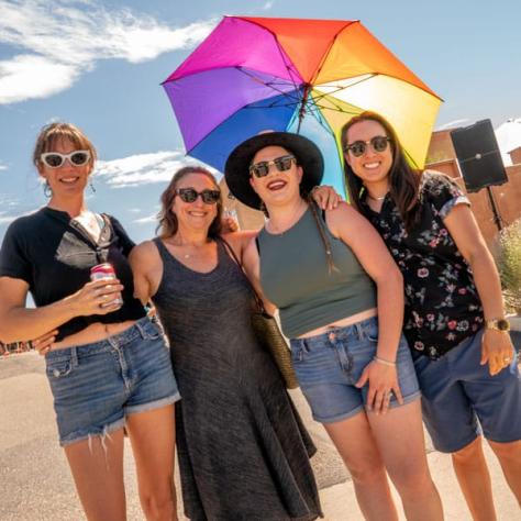 People posing for photo together. 