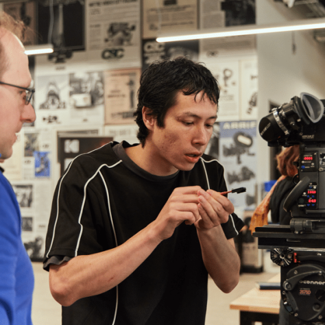 People working with a camera.