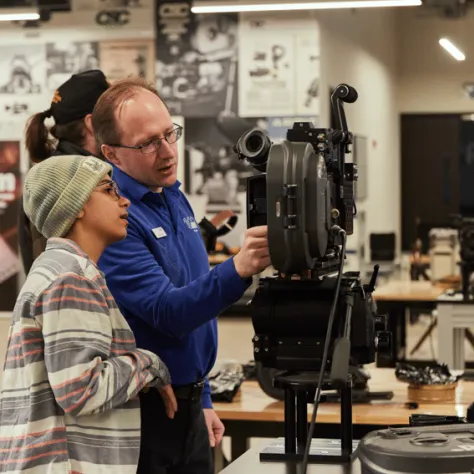 People working with a camera. 