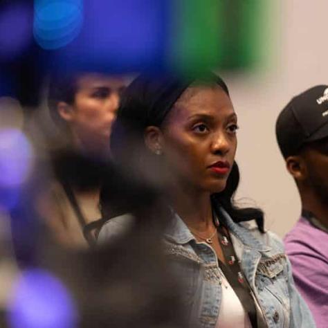 People in audience watching something. 