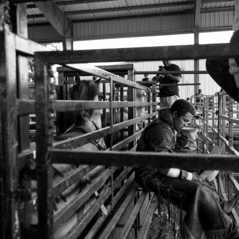 Black and white of people working on a farm. 