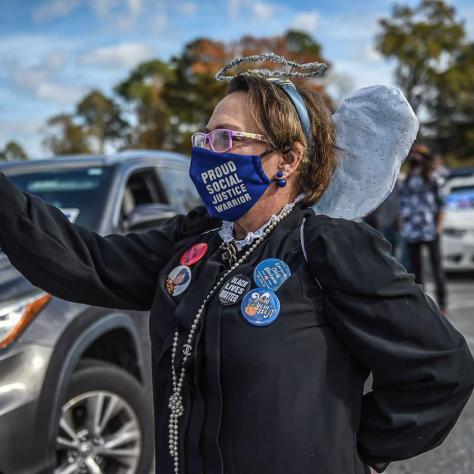 Woman with mask taking a photo. 