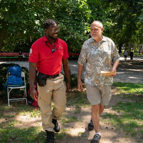 Two men walking together. 