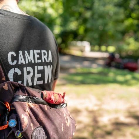 Back of shirt that says "Camera Crew"