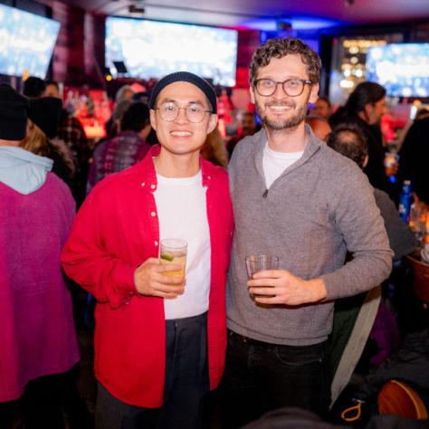 People posing for photo at party.