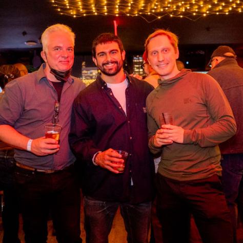 People posing for photo at party.