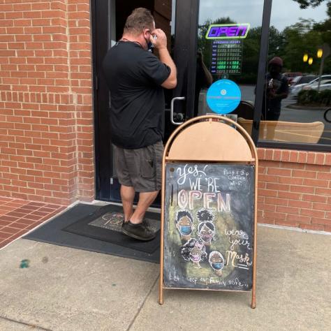 As restrictions eased, we were able to open up the coffee shop. Thanks to the hand drawing by Tiffany Adé, we encouraged our customers to mask up upon entry.