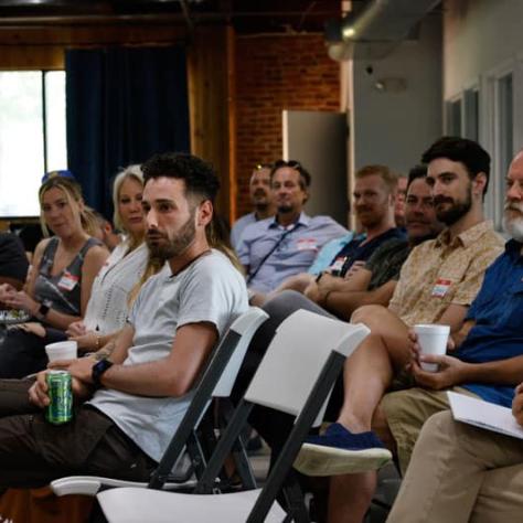 Audience watching presenters.