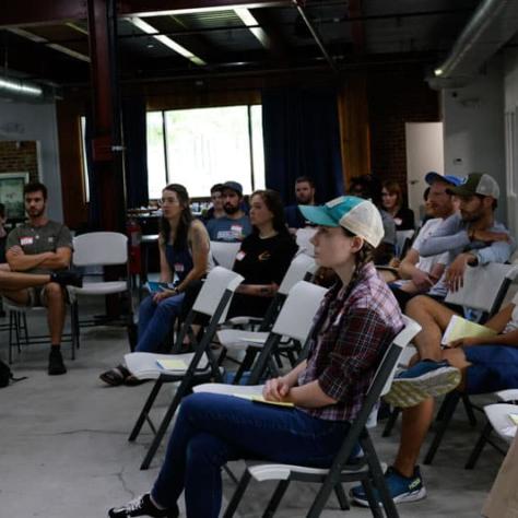 Audience watching presenters. 