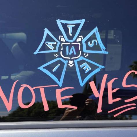 Vote Yes drawing on car window. 