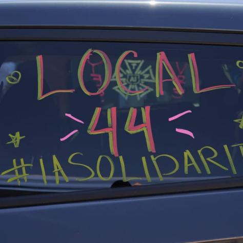 Drawing of solidarity on car window. 