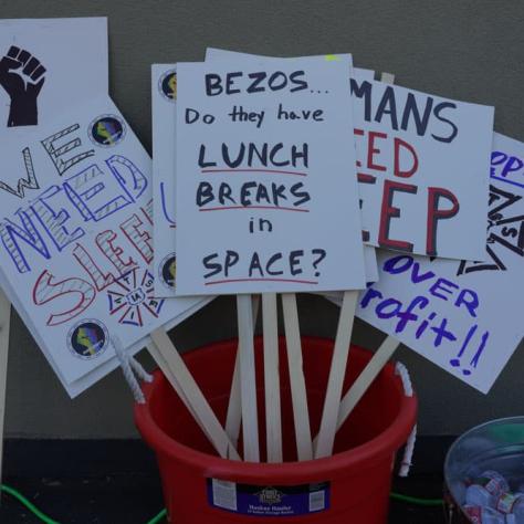 Signs displayed in a bucket. 