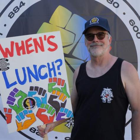 People posing with signs. 