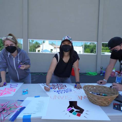 People making signs. 