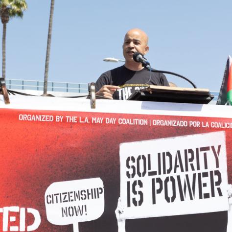 Man speaking at rally. 