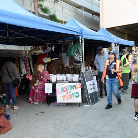 People shopping at yard sale.