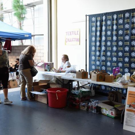 People shopping at yard sale.