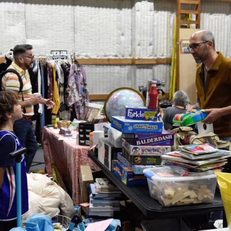 People shopping at yard sale.