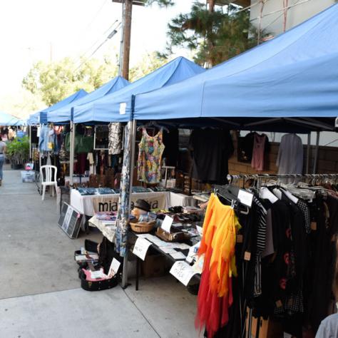 View of tents outside at yard sale. 