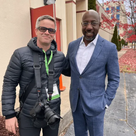 Two men posing for a photo. 