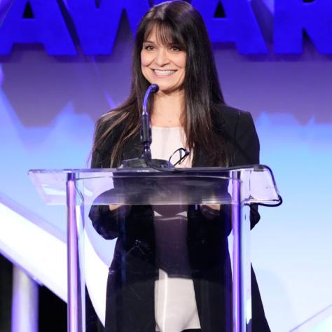 Presenter Karen Chamberlain presents the Les Mason Award for Career Achievement in Publicity to Gabriela Gutentag (Photo by: Evans Vestal Ward/ICG)