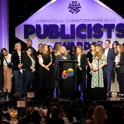 Group photo of people on stage. 