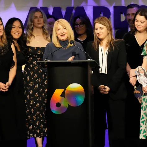 Group photo of people on stage. 