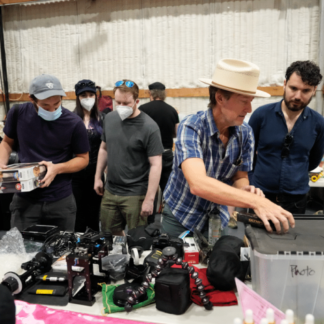 People looking at yard sale items. 