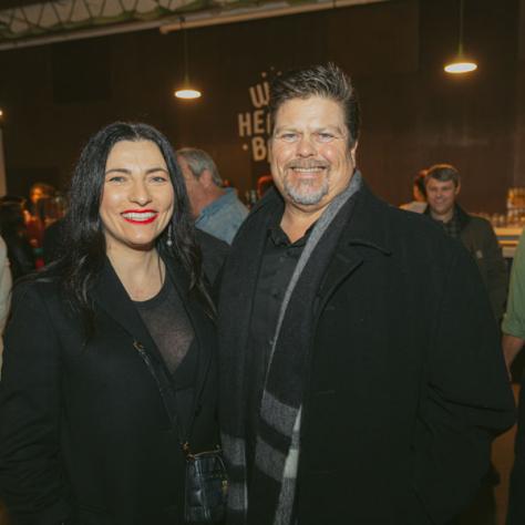 People posing for photo at party.