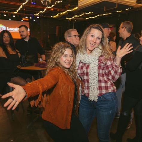 People posing for photo together at party.