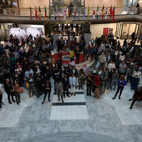 Arial view of people at event posing for a photo. 