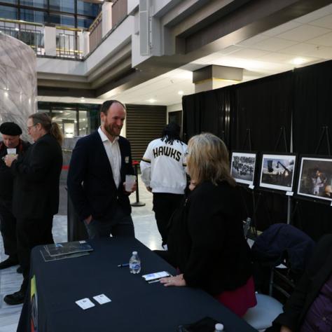 People networking at event. 