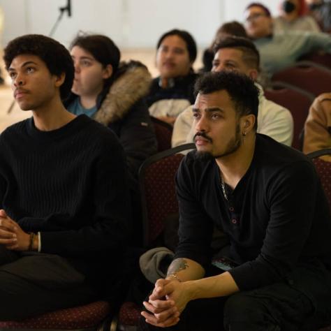 Audience members watching. 